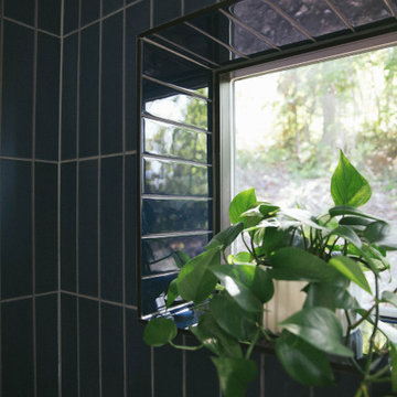 Blue Glass Tile Shower with Recessed Window
