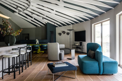 Photo of a large contemporary formal and grey and cream open plan living room in Surrey with black walls, medium hardwood flooring, beige floors, exposed beams and a wall mounted tv.