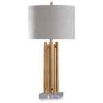 Harp and Finial - Venetian Table Lamp Gold Finish on Metal Body with Crystal Base Light Gray Shade - The Venetian table lamp uses its gold finish touches on a metal body to enhance the regal and refined qualities of its abstract crystal base. Topped with a cool light gray hardback shade, this lamp uses mixed material elements to create impact. Add this delightful piece to rooms throughout your home, from the bedroom to the foyer, for an instant modern twist.