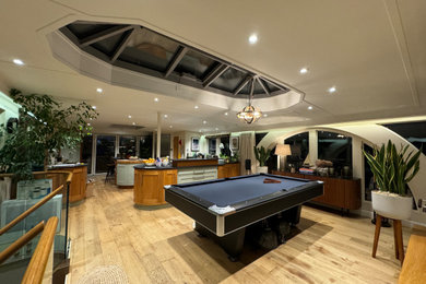 Contemporary games room in London with a game room and feature lighting.