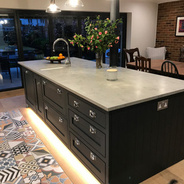 Traditional grey bespoke kitchen with large island and open shelving