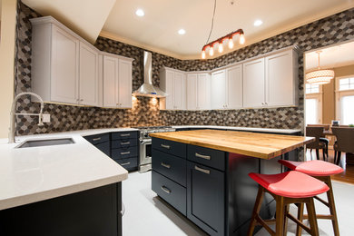Example of a mid-sized trendy u-shaped porcelain tile and white floor eat-in kitchen design in DC Metro with an undermount sink, shaker cabinets, gray cabinets, quartz countertops, gray backsplash, glass tile backsplash, stainless steel appliances and an island