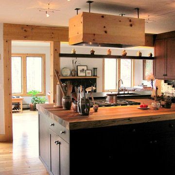 Two tones of cherry cabinets and reclaimed wood counter