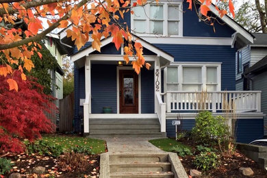 Mid-sized arts and crafts blue two-story exterior home photo in Seattle