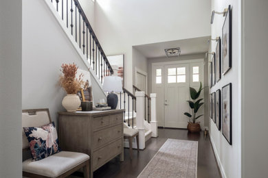 Mid-sized mountain style medium tone wood floor entryway photo in Seattle with gray walls