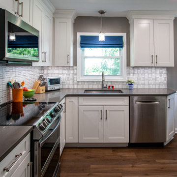 White Kitchen with White Tile Backsplash and Quartz Countertop