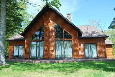 This is an example of a transitional one-storey brown exterior in Other with wood siding.
