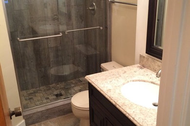 Mountain style gray tile and porcelain tile alcove shower photo in Richmond