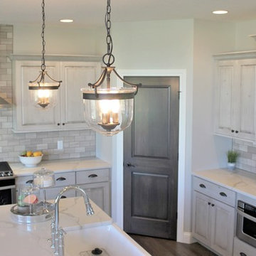 Aspen Homes- Antique White painted cabinets with Gray Stained Accents