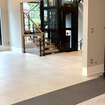 Project #136 | Modern Floating Staircase Encircling Glass Elevator