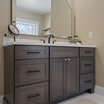 Warm and Cohesive Multi-Bathroom Design In Nokesville