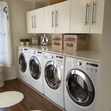 Super efficient 2 Washer and Dryer Laundry Room.
