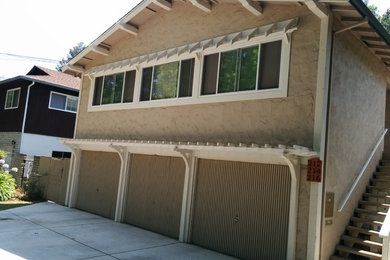 Example of a mid-sized classic beige two-story mixed siding gable roof design in San Francisco