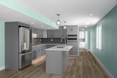 Example of a minimalist vinyl floor and brown floor eat-in kitchen design in Denver with gray cabinets, quartz countertops, gray backsplash, stainless steel appliances, an island and white countertops