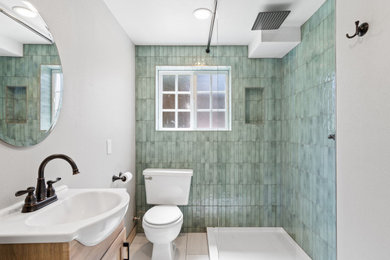 Example of a small beach style 3/4 turquoise tile and ceramic tile porcelain tile, gray floor and single-sink bathroom design in Portland with light wood cabinets, an integrated sink, white countertops, a niche and a freestanding vanity