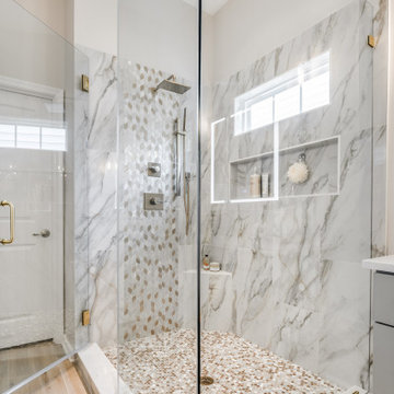 Glass Shower with Marble Tile and Penny Round Floor