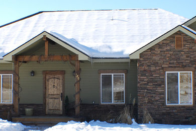 Mid-sized green one-story exterior home photo in Other