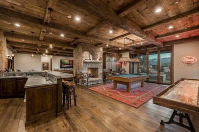 Basement - rustic basement idea in Salt Lake City with beige walls