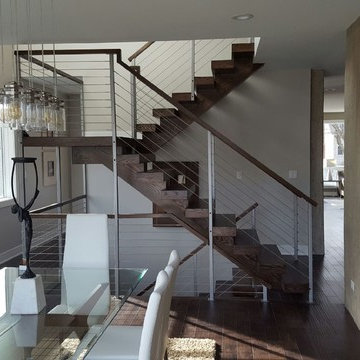 Open riser stairs with stainless steel cable wire railing