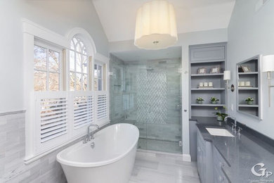 Bathroom - large traditional master gray tile and marble tile marble floor and gray floor bathroom idea in Boston with beaded inset cabinets, gray cabinets, a two-piece toilet, gray walls, a drop-in sink, quartz countertops, a hinged shower door and gray countertops