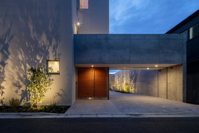 東京23区にあるモダンスタイルのおしゃれな家の外観 (コンクリートサイディング、長方形) の写真