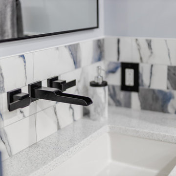 Bathroom remodeling in Columbia, MD with double vanity & marble bathtub