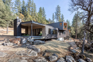 Inspiration for a modern metal exterior home remodel with a metal roof