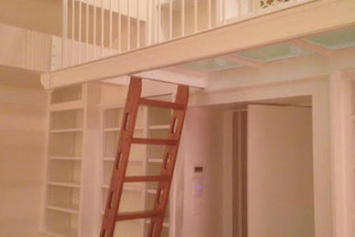 Home studio - large traditional medium tone wood floor home studio idea in Boston with white walls
