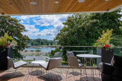 Patio - contemporary patio idea in Vancouver with decking and a roof extension
