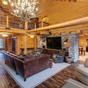 Antique Skip Oak Flooring in a Log Cabin Great Room