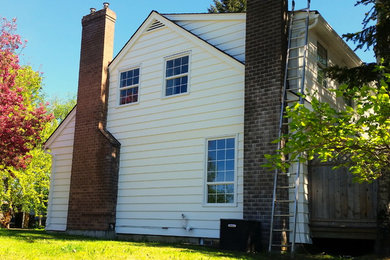 Inspiration for a timeless white two-story vinyl exterior home remodel in Vancouver