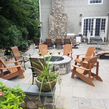 Patio with stone wall and fire pit