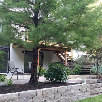 Natural stone retaining wall for a new addition house
