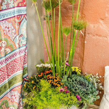 East Village Balcony Staged as Vintage Boho Picnic for Couple's Engagement Party