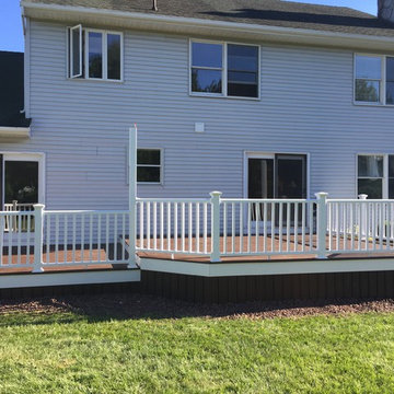 Trex Transcend decking, Picture frame, white trim, vinyl railings