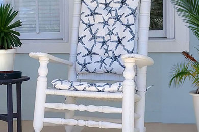 Beach style wood railing front porch idea in Atlanta with decking and a roof extension