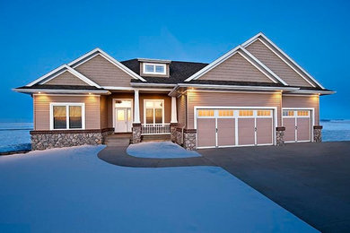 Large craftsman brown two-story mixed siding gable roof idea in Cedar Rapids