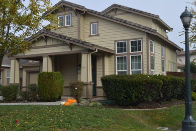Mid-sized elegant brown two-story wood exterior home photo in Sacramento