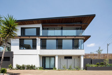 This is an example of a beach style exterior in Sydney.