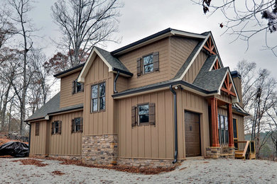 Inspiration for a mid-sized country three-storey brown exterior in Atlanta with mixed siding.