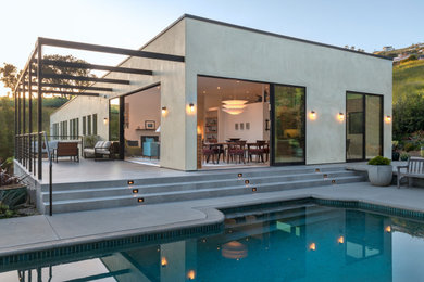 Example of a mid-sized trendy home design design in Los Angeles