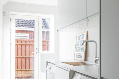 This is an example of a scandinavian utility room in Sussex.