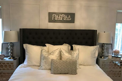 Large trendy master dark wood floor bedroom photo in Montreal with white walls