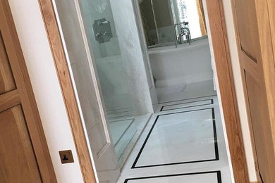 Marble Bathroom with Black Granite borders in Kensington