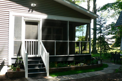 Mid-sized elegant gray one-story vinyl exterior home photo in Grand Rapids with a clipped gable roof