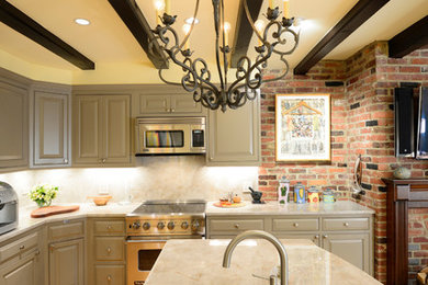 Inspiration for a transitional l-shaped eat-in kitchen remodel in DC Metro with an undermount sink, gray cabinets, stone slab backsplash and paneled appliances