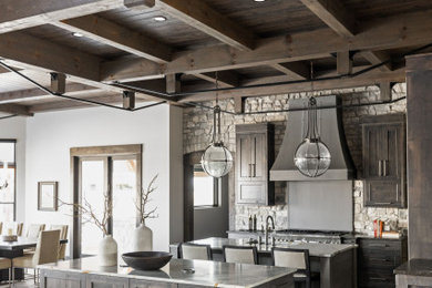 Inspiration for a large rustic l-shaped kitchen in Indianapolis with a submerged sink, recessed-panel cabinets, medium wood cabinets, quartz worktops, grey splashback, stone tiled splashback, integrated appliances, porcelain flooring, multiple islands, beige floors, white worktops and a coffered ceiling.