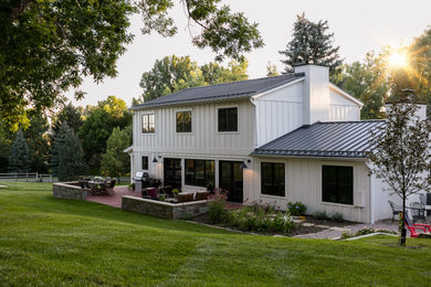 Example of a cottage exterior home design in Denver