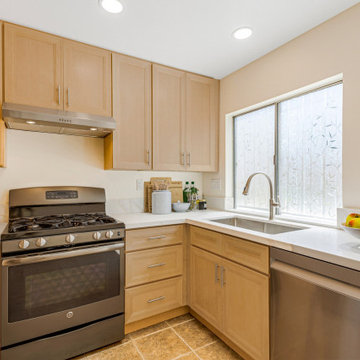 Quartz Slab Backsplash Behind Gas Range