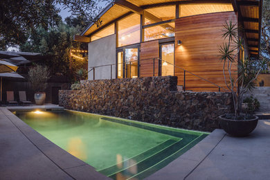 Pool - mid-sized contemporary backyard concrete and rectangular pool idea in Los Angeles